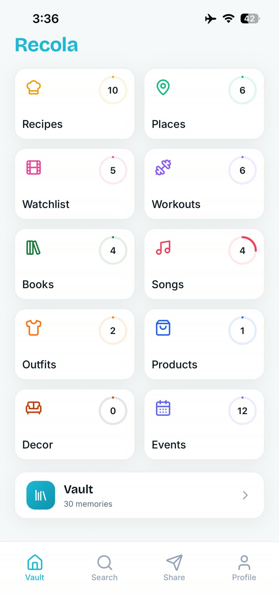 Recola home screen — ten tiles holding saved recipes, places, watchlist, workouts, books, songs, outfits, products, decor and events